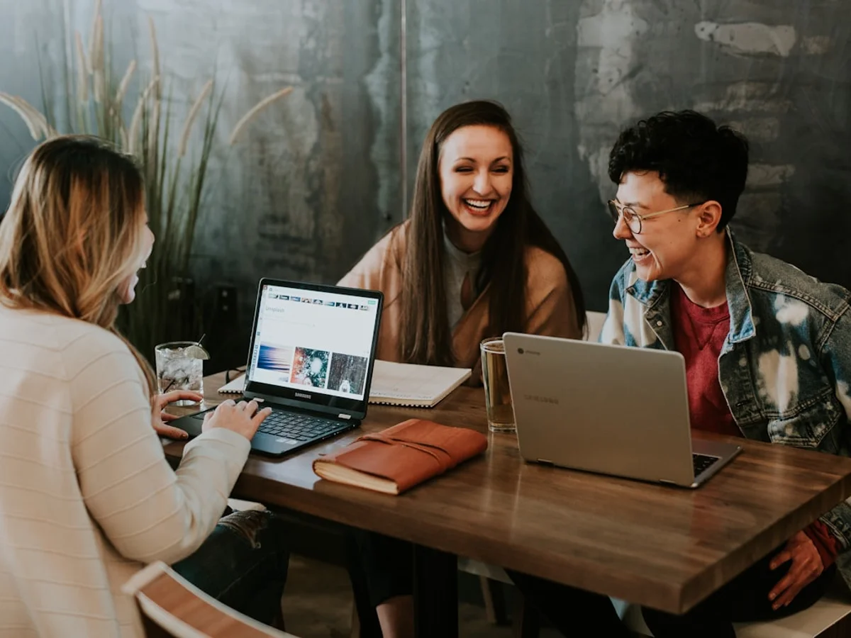 Small creative team reviewing a shareable Instagram post on a shared screen