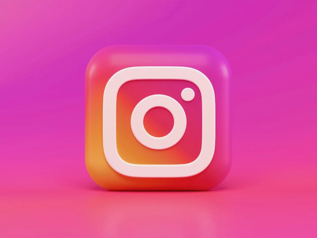 Close-up of a smartphone displaying Instagram Reels analytics in soft natural light
